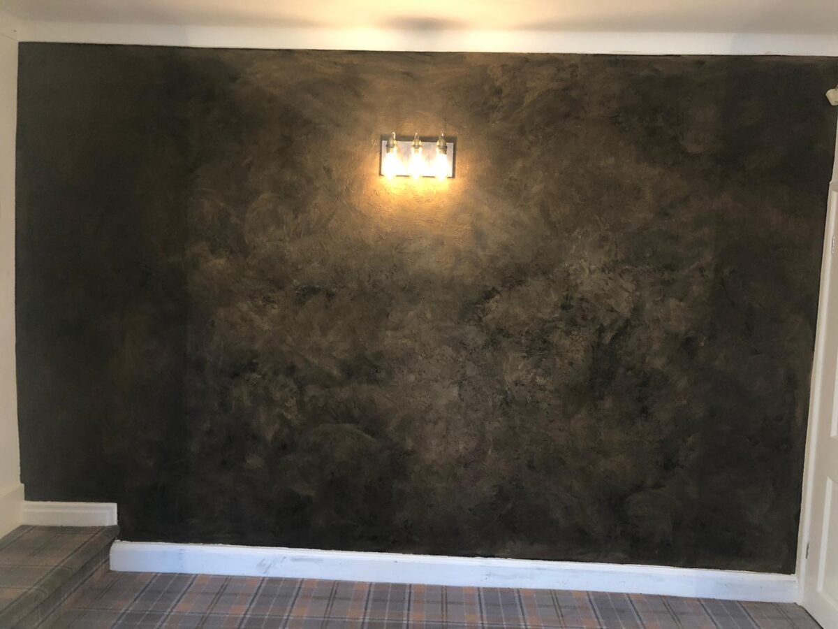 A Feature Wall Textured Marmarino Finished In A Black And
